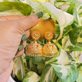 Gold-Plated Traditional Temple Jhumka Earrings with Deity Motif