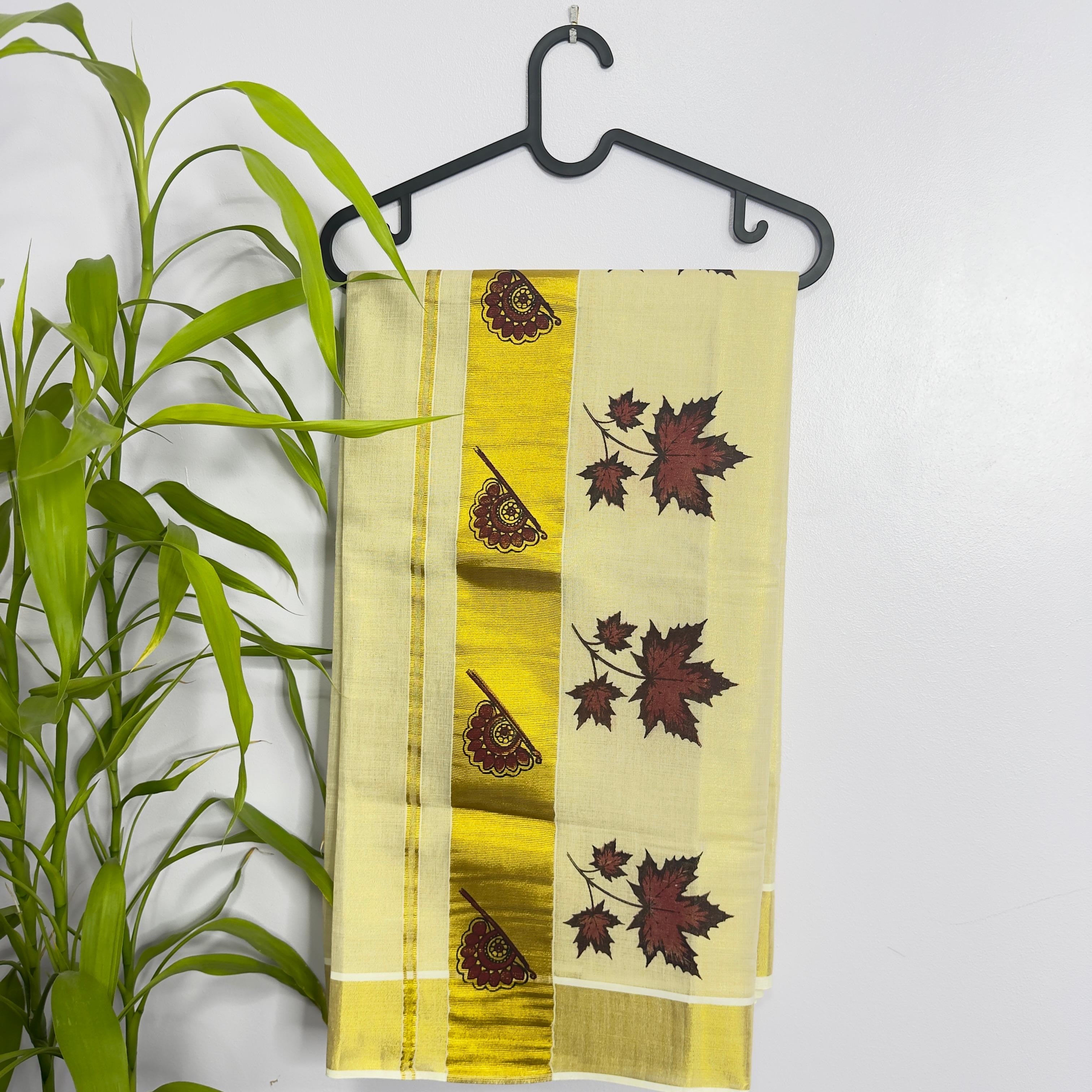 Kerala Tissue Saree with Elegant Floral Motifs
