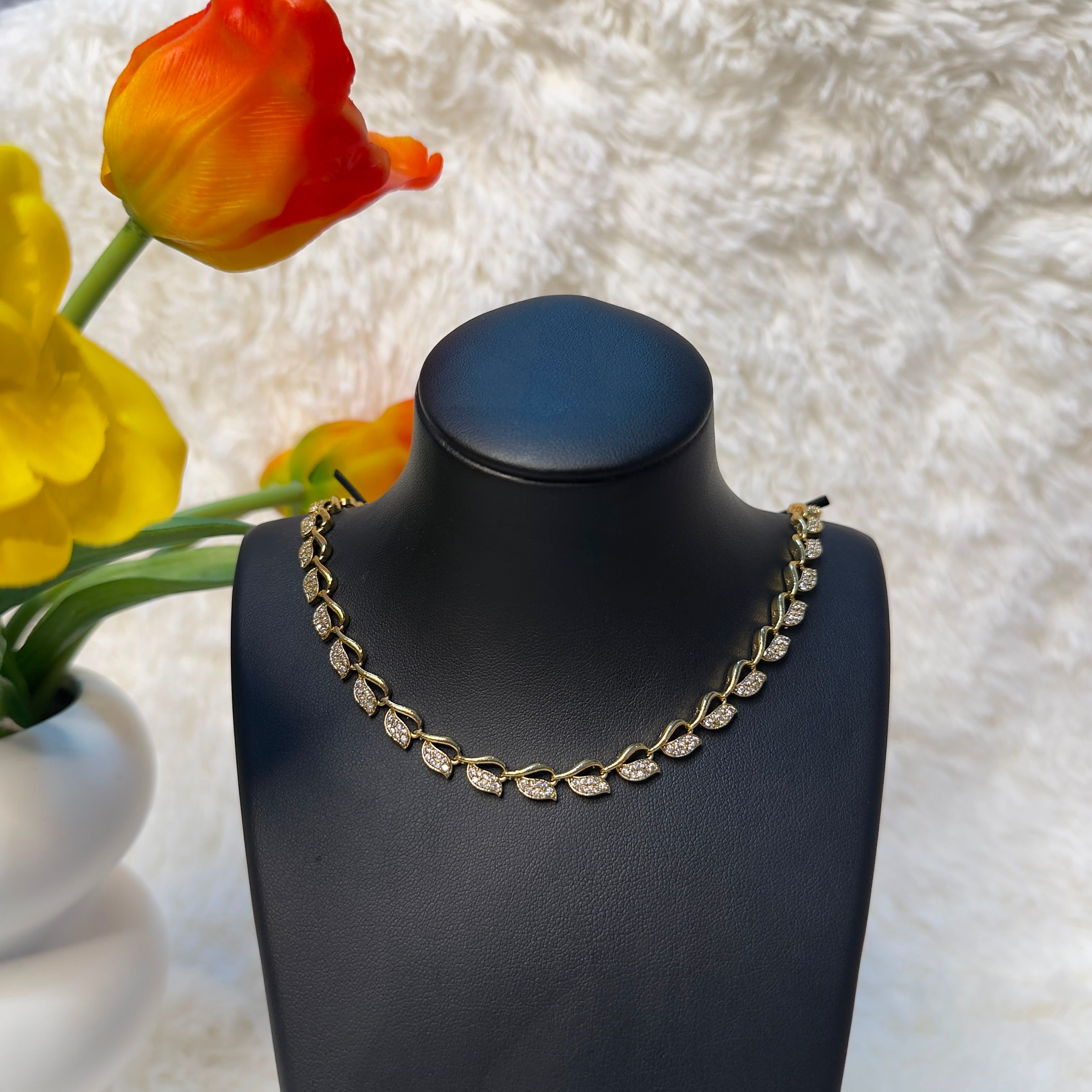 Gold Tone Leaf Motif American Diamond Necklace