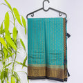 Teal Semi Banarasi Saree with Contrast Black Border and Tussles