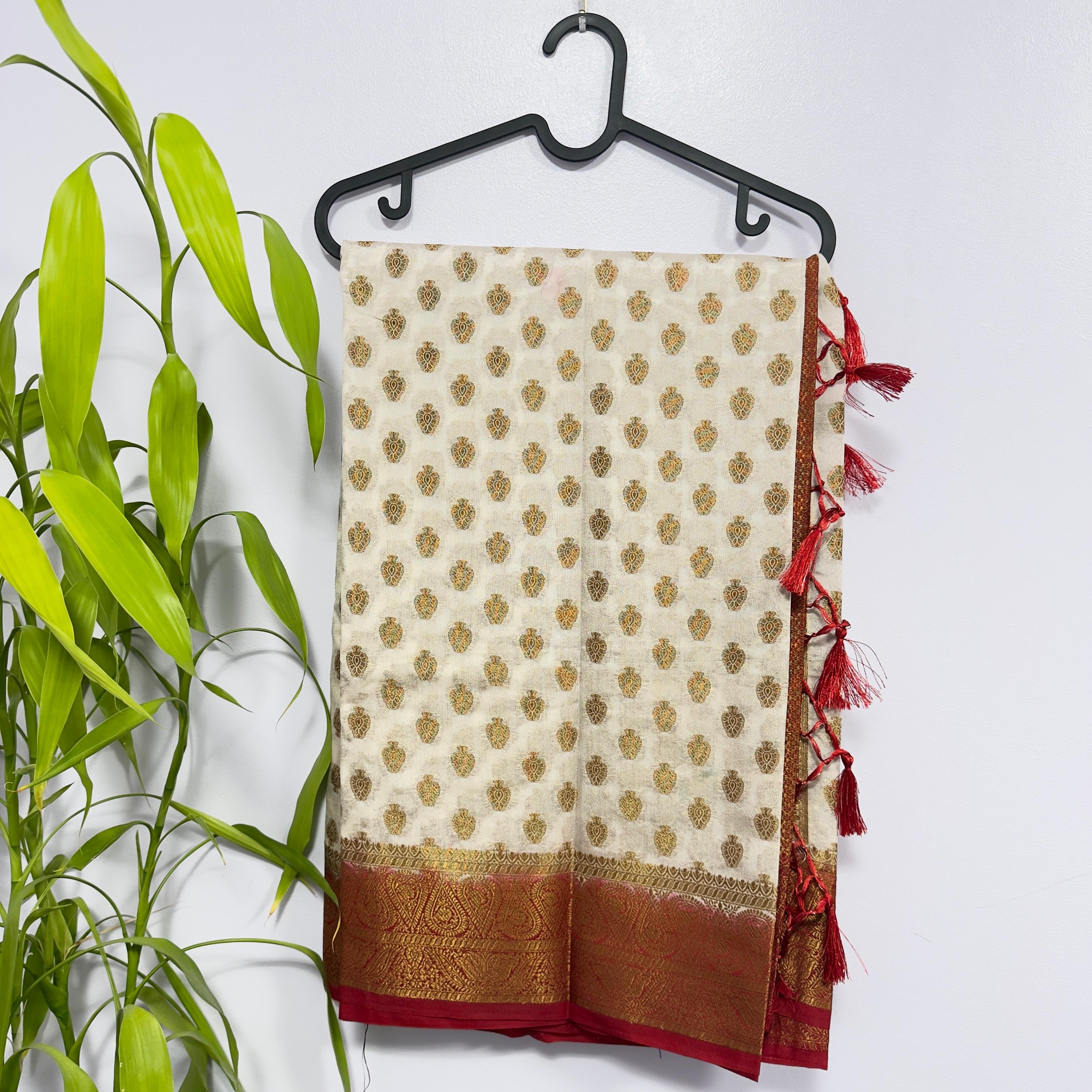 Off-White Semi Banarasi Saree with Contrast Red Border and Tussles
