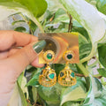 Gold-Plated Traditional Jhumka Earrings with Palakka Stone Inlay